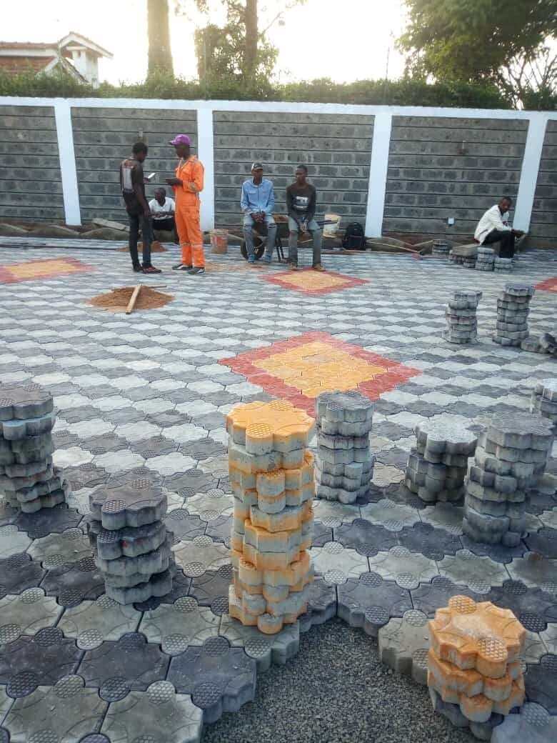 Workers installing pavers